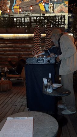 Evening rooftop gathering with DJ documented in Cape Town