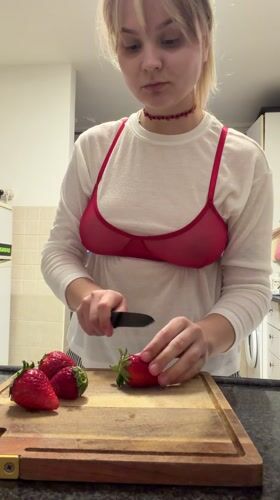 Woman bakes strawberry tart in Tel Aviv kitchen