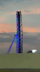 Illuminated Ferris wheel stands motionless against twilight sky in Puebla