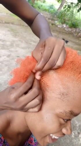 Casual afternoon hair styling and relaxation documented in Keffi, Nigeria