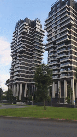 Dark modern apartment towers on pillars in Riga