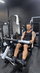 Gym users exercise on leg equipment in Choeng Mon