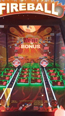 Inside a Bari arcade packed with game cabinets and color