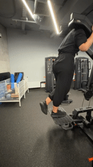 Woman completes morning barbell workout session in Saint Petersburg gym