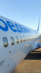 Pobeda aircraft observed with distinctive blue lettering and windows