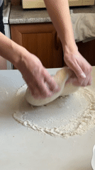 Woman prepares homemade dough in Surgut kitchen