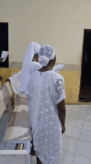 Evening worship service in white attire, Lagos church