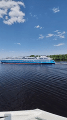 Cruise ship sails through Selishchi waters on clear day