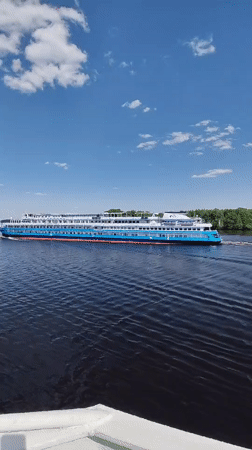 Cruise ship sails through Selishchi waters on clear day