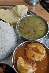 Classic Nepalese thali meal on a metal platter in Kathmandu