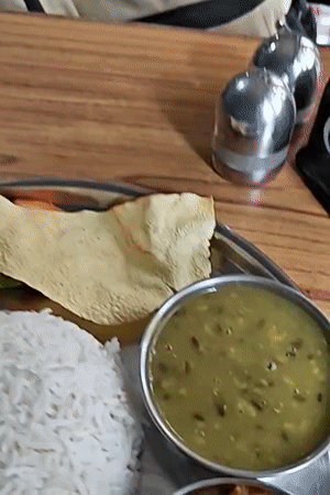 Classic Nepalese thali meal on a metal platter in Kathmandu