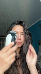 Woman uses hair trimmer, hashtag image captured in Kazan