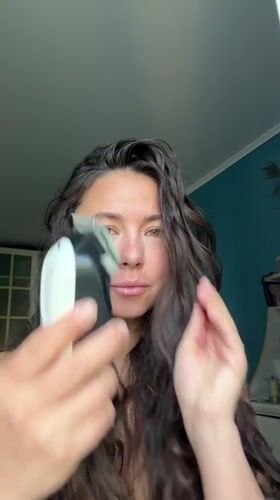 Woman uses hair trimmer, hashtag image captured in Kazan