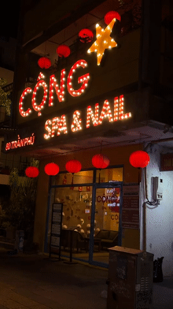 Late-night scooter ride through Da Nang's lit-up streets