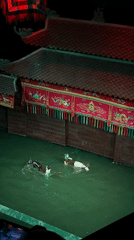Traditional water puppet show performs in Hanoi with musicians