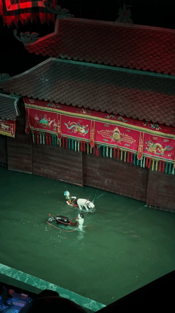 Traditional water puppet show performs in Hanoi with musicians