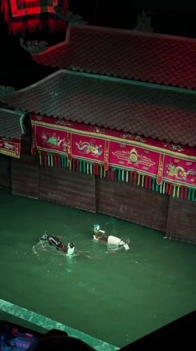 Traditional water puppet show performs in Hanoi with musicians