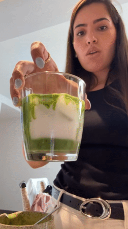 Woman prepares matcha tea and steak dinner in Mexican kitchen