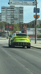 Lime green Lamborghini Urus stops at Yekaterinburg traffic light