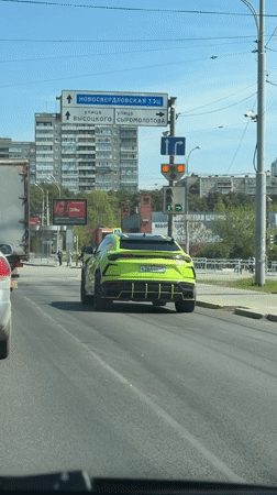 Lime green Lamborghini Urus stops at Yekaterinburg traffic light