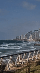 Kite surfer spotted in rough seas off coastal city