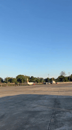 Traveler documents evening activities at Indonesian airport terminal