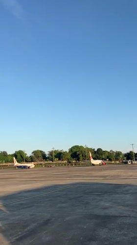 Traveler documents evening activities at Indonesian airport terminal