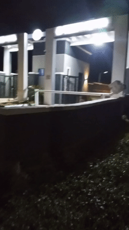 Nighttime activity captured at Bukuru hotel entrance and food stand