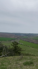 Person observed at cliff overlooking rural Razgrad countryside
