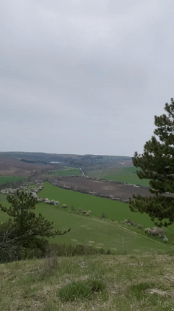 Person observed at cliff overlooking rural Razgrad countryside