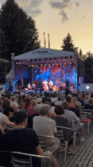 Live ukulele performance at an outdoor evening concert in Bansko
