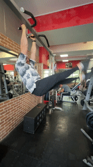 Man exercises on pull-up bar at Saint Petersburg gym