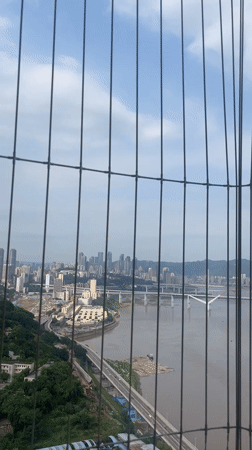 City skyline viewed through fence in Yuzhong District