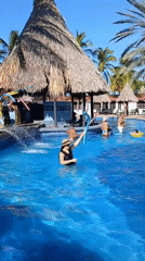 Resort guests enjoy pool activities in Porlamar, Venezuela