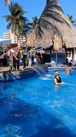Resort guests enjoy pool activities in Porlamar, Venezuela