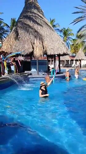 Resort guests enjoy pool activities in Porlamar, Venezuela