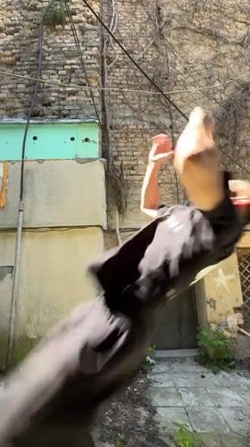 Man performs backflip, smokes in Shumen alleyway
