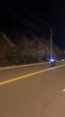 Motorcycle rider observed on heritage area road in Vietnam