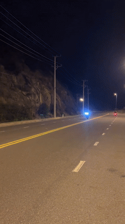 Motorcycle rider observed on heritage area road in Vietnam