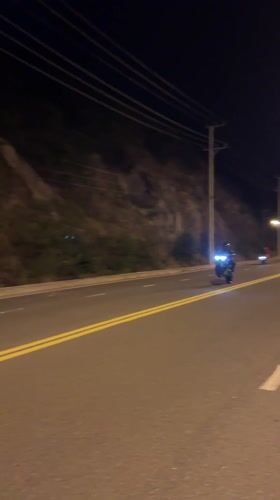 Motorcycle rider observed on heritage area road in Vietnam