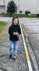 Cats spotted throughout Esenyurt district, girl approaches street cat