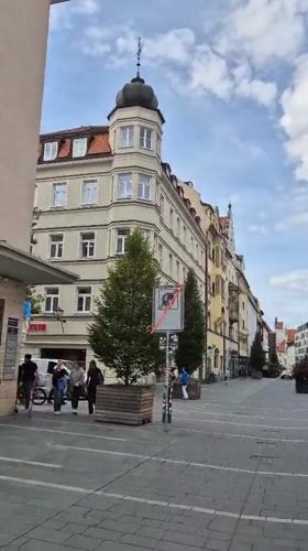 Strolling through Regensburg's historic city center on a summer afternoon