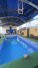 Young man enjoys afternoon swim session in Nkpor pool