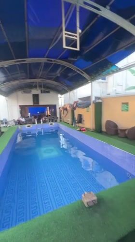 Young man enjoys afternoon swim session in Nkpor pool