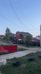 Motorbike rider spotted on dirt road in Chaikovsky residential area