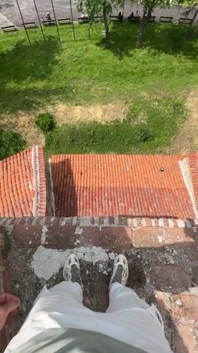Person stands on building edge in Vidin, Bulgaria