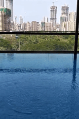 Indoor pool with city view captured in Mumbai