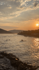 Cruise ships, yachts, and waterfront scenes at sunset