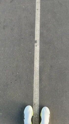 Runner documented on Pont de Bir-Hakeim bridge, Paris morning