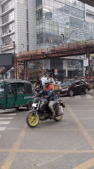 Early morning street life documented across Dhaka intersections